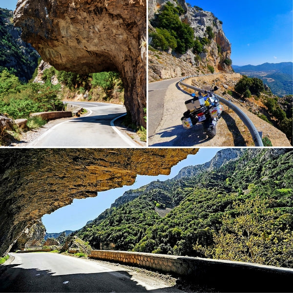 scenic motorcycle routes in Greece, featuring a winding road passing directly under a massive rock overhang and a view of an adventure motorcycle parked on a cliffside road.